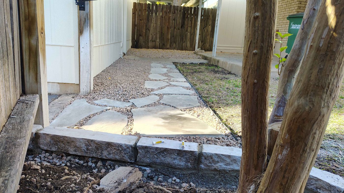 Flagstone walkway with crushed-stone curbing